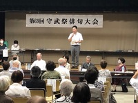 写真:会場での挨拶の様子