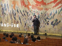 写真:会場での挨拶の様子