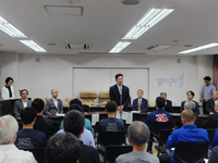 写真:会場での挨拶の様子