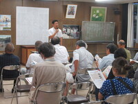 写真:会場での挨拶の様子
